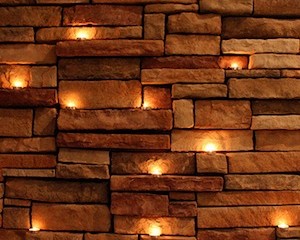 Tealights against brick wall