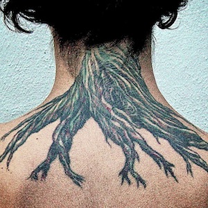 Woman with tree root tattoo