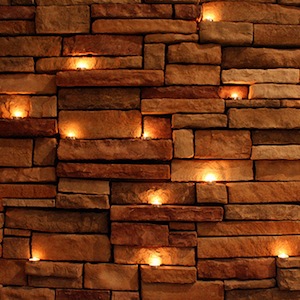 Tealights against brick wall